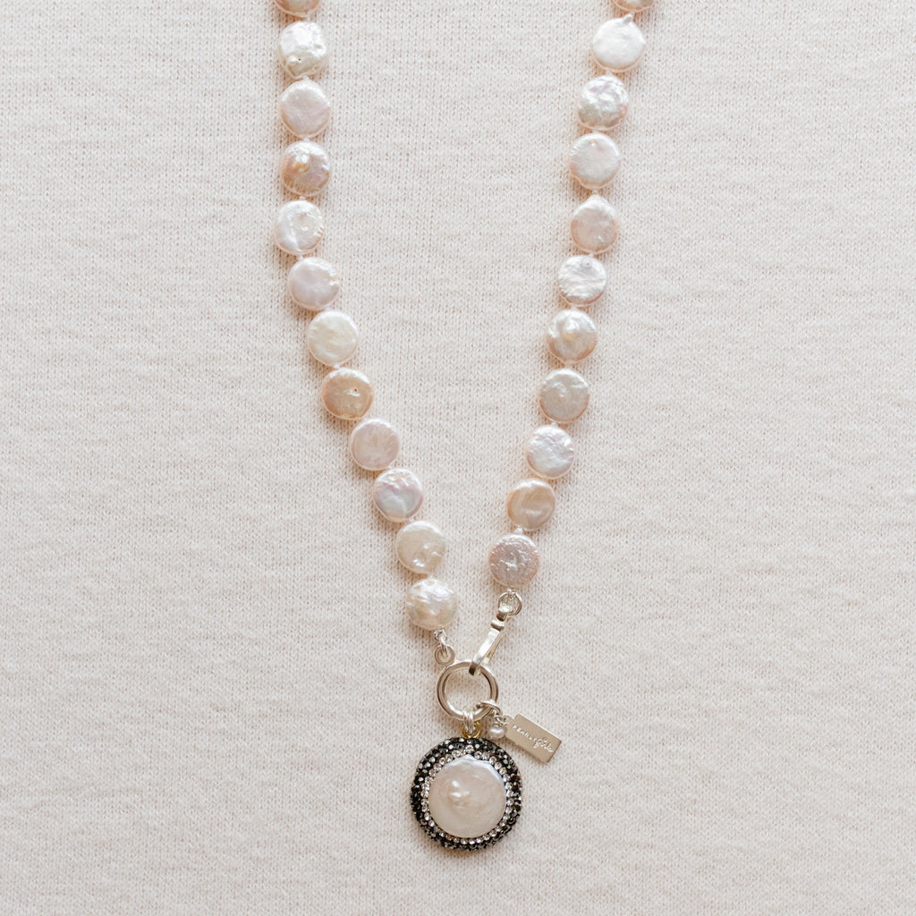 Pearly Girls Classic Necklace, featuring a coin pearl with a marcasite pendant. This necklace elegantly pairs the unique, flat shape of a coin pearl with the sparkling allure of a marcasite pendant, creating a sophisticated piece that blends classic pearl elegance with a touch of vintage charm.