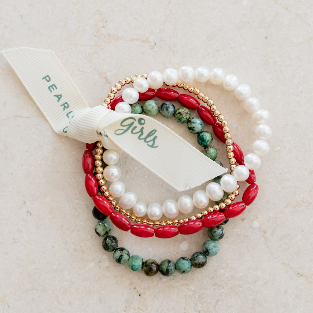 Elegant bracelet bundle by Pearly Girls, showcasing a vibrant mix of African turquoise and pearls. The design combines the unique, earthy tones of turquoise beads with the classic beauty of pearls, creating a visually striking and versatile accessory.