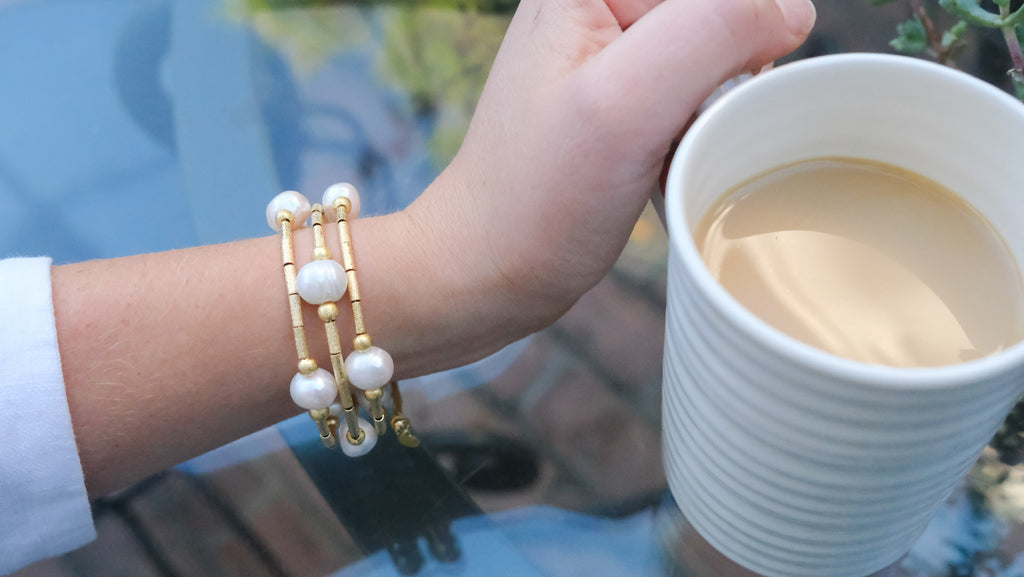Gold and Pearl Twisted Stretchy Bracelet by Pearly Girls, a gold pearl bracelet. This piece artfully intertwines gold accents with pearls in a stretchy design, offering a blend of classic pearl elegance and the luxurious appeal of gold in a comfortable, stylish accessory.