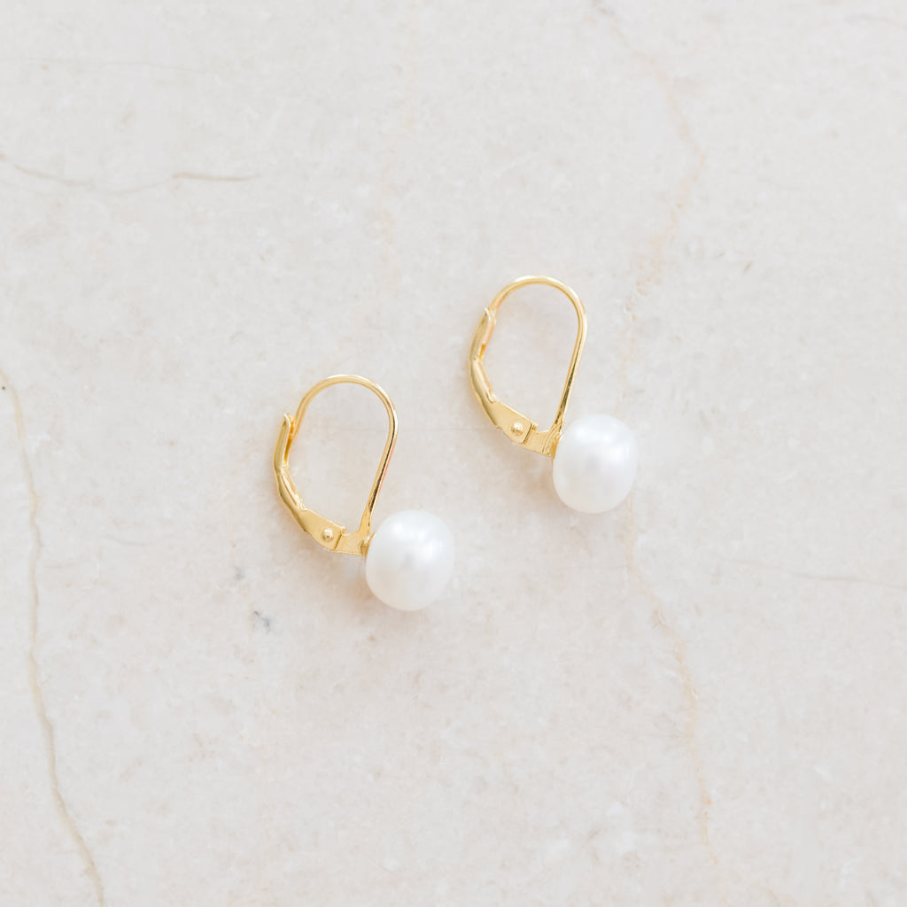 Pearl Studs on Lever Back Earrings by Pearly Girls, embodying timeless elegance with a modern twist. These earrings feature classic pearl studs, securely set on contemporary lever back closures, offering a perfect blend of traditional pearl beauty and modern convenience and style.