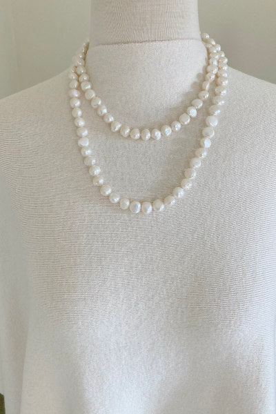 Baroque Pearl Necklace by Pearly Girls, showcasing luxurious irregular beauty from China's pearl farms. This necklace features a string of uniquely shaped baroque pearls, each offering its own distinct luster and charm, embodying the natural elegance and richness of Chinese pearl farming tradition.