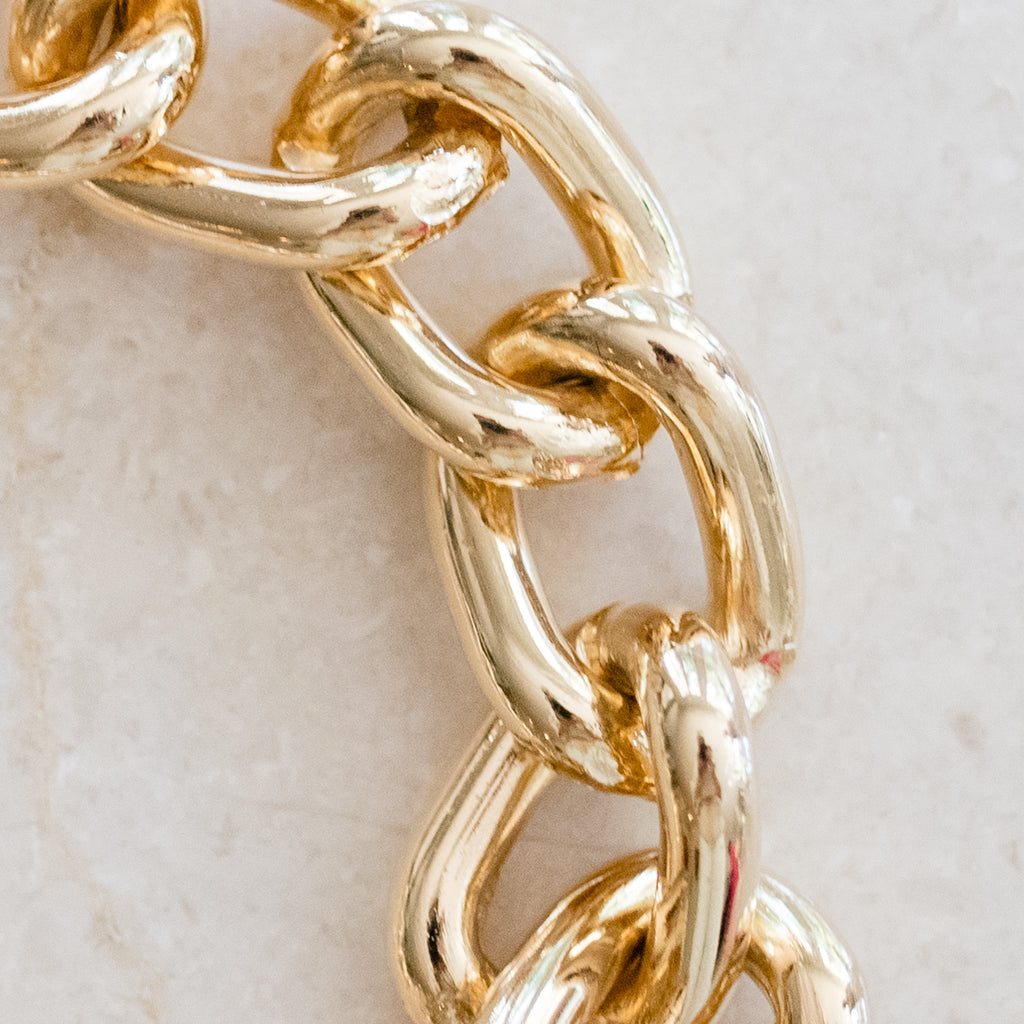 Gold-Filled Cuban Chain Link Bracelet by Pearly Girls, showcasing bold elegance with a timeless design. This bracelet features the classic and robust style of Cuban chain links in gold-filled material, offering a striking and durable piece that combines contemporary fashion with enduring appeal.
