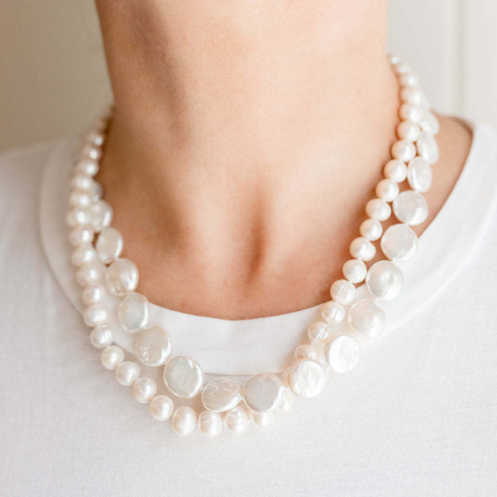 Chloe Pearl Necklace by Pearly Girls is a double strand freshwater pearl necklace. It features two layers of beautifully matched pearls, offering a luxurious and fuller appearance that embodies classic elegance and sophistication in pearl jewelry.