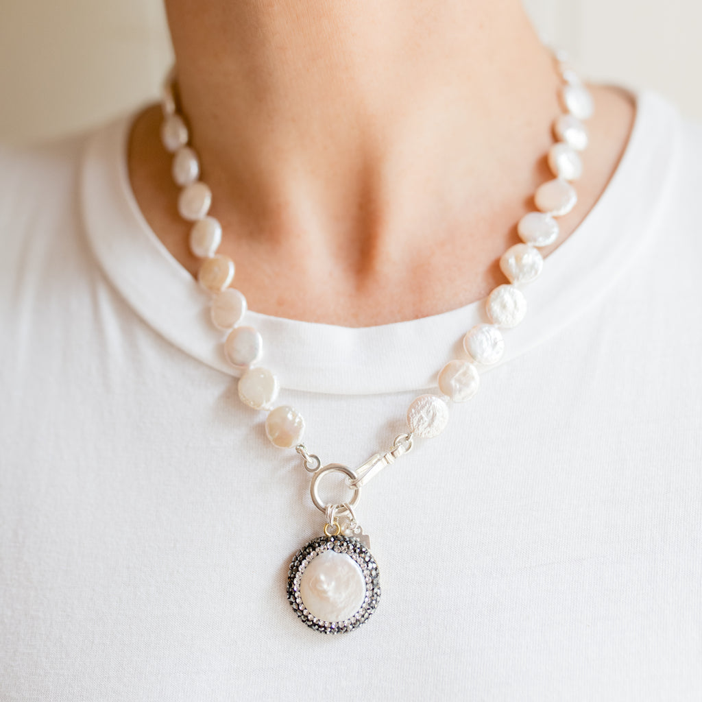 Pearly Girls Classic Necklace, featuring a coin pearl with a marcasite pendant. This necklace elegantly pairs the unique, flat shape of a coin pearl with the sparkling allure of a marcasite pendant, creating a sophisticated piece that blends classic pearl elegance with a touch of vintage charm.