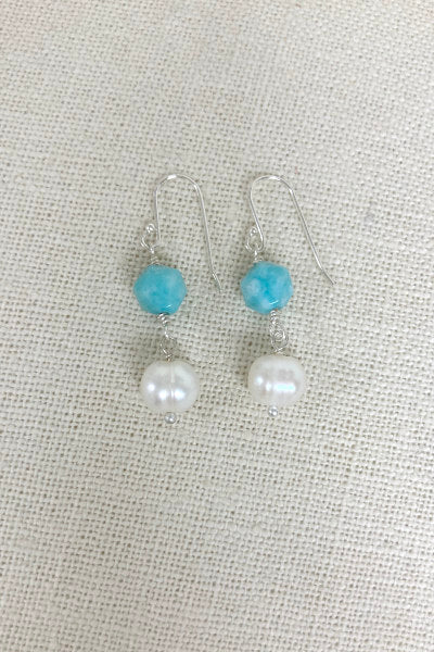 Charming Amazonite and pearl earrings by Pearly Girls, inspired by the ocean's beauty. These earrings showcase a harmonious combination of lustrous pearls and serene blue-green amazonite stones, reflecting the tranquility and elegance of the sea