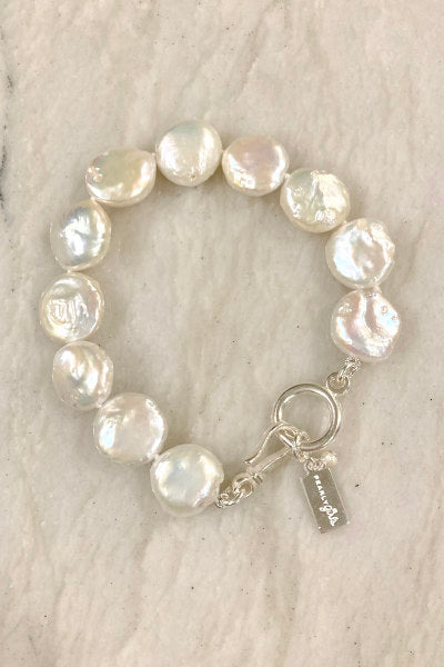 Coin Pearl Bracelet by Pearly Girls, featuring flat coin pearls. This bracelet highlights the elegant simplicity of coin pearls, known for their unique, flat shape, offering a sleek and modern take on classic pearl elegance.