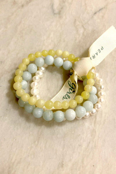 Aquamarine and Pearl Bracelet Bundle by Pearly Girls, evoking sunlit seas and pearly gleams. This set combines the cool, calming hues of aquamarine with the soft luster of pearls, creating a serene and elegant accessory that captures the essence of oceanic beauty