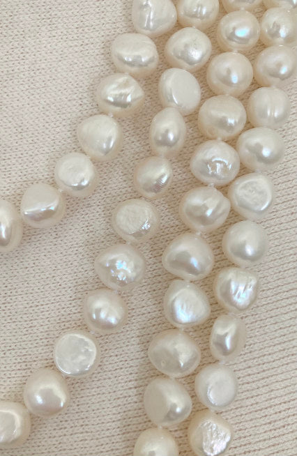Baroque Pearl Necklace by Pearly Girls, showcasing luxurious irregular beauty from China's pearl farms. This necklace features a string of uniquely shaped baroque pearls, each offering its own distinct luster and charm, embodying the natural elegance and richness of Chinese pearl farming tradition.