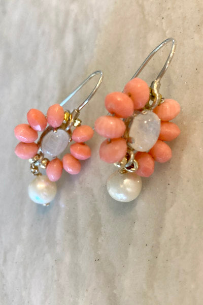 Coral Gems and Pearl Earrings by Pearly Girls, featuring moonstone accents and artisan craftsmanship. These earrings elegantly pair the warm tones of coral gems with the lustrous touch of pearls, enhanced by the mystical shimmer of moonstone, reflecting skilled artisanship and unique design.