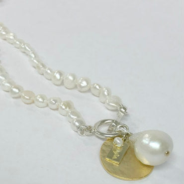 Haley Pearl Necklace by Pearly Girls, featuring nugget pearls and a fireball pendant. This necklace showcases the unique texture of nugget pearls combined with a striking fireball pendant, creating a piece that blends natural irregularity with a bold, eye-catching accent.