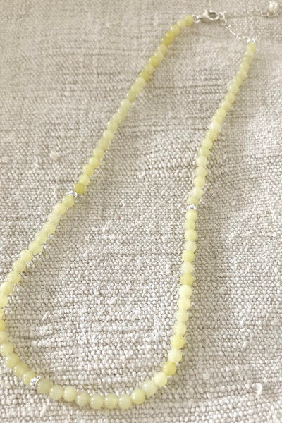 Lemon Jade Necklace by Pearly Girls, showcasing gemstone elegance with sterling silver accents. This necklace features the vibrant and refreshing hue of lemon jade beads, complemented by the sophistication of sterling silver elements, creating a bright and elegant piece.