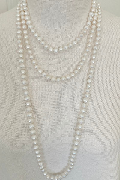 Classic Ring Pearl Necklace by Pearly Girls, featuring freshwater pearls with distinctive rings. This necklace highlights the unique ringed patterns of each pearl, creating a classic yet intriguing look that adds depth and character to this elegant piece.